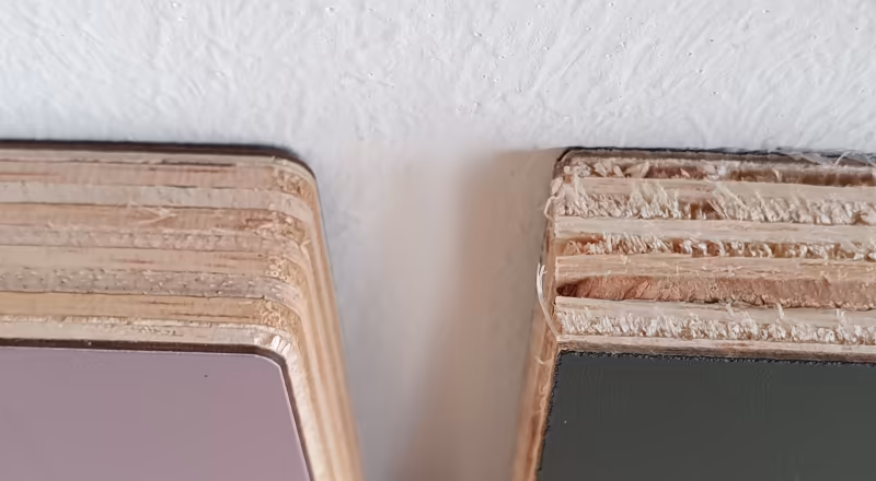 Image: Albasia / Albizia plywood sandwiched between HPL coatings. Saw cut reveals to be much more coarse with pull-outs versus the milled surface.