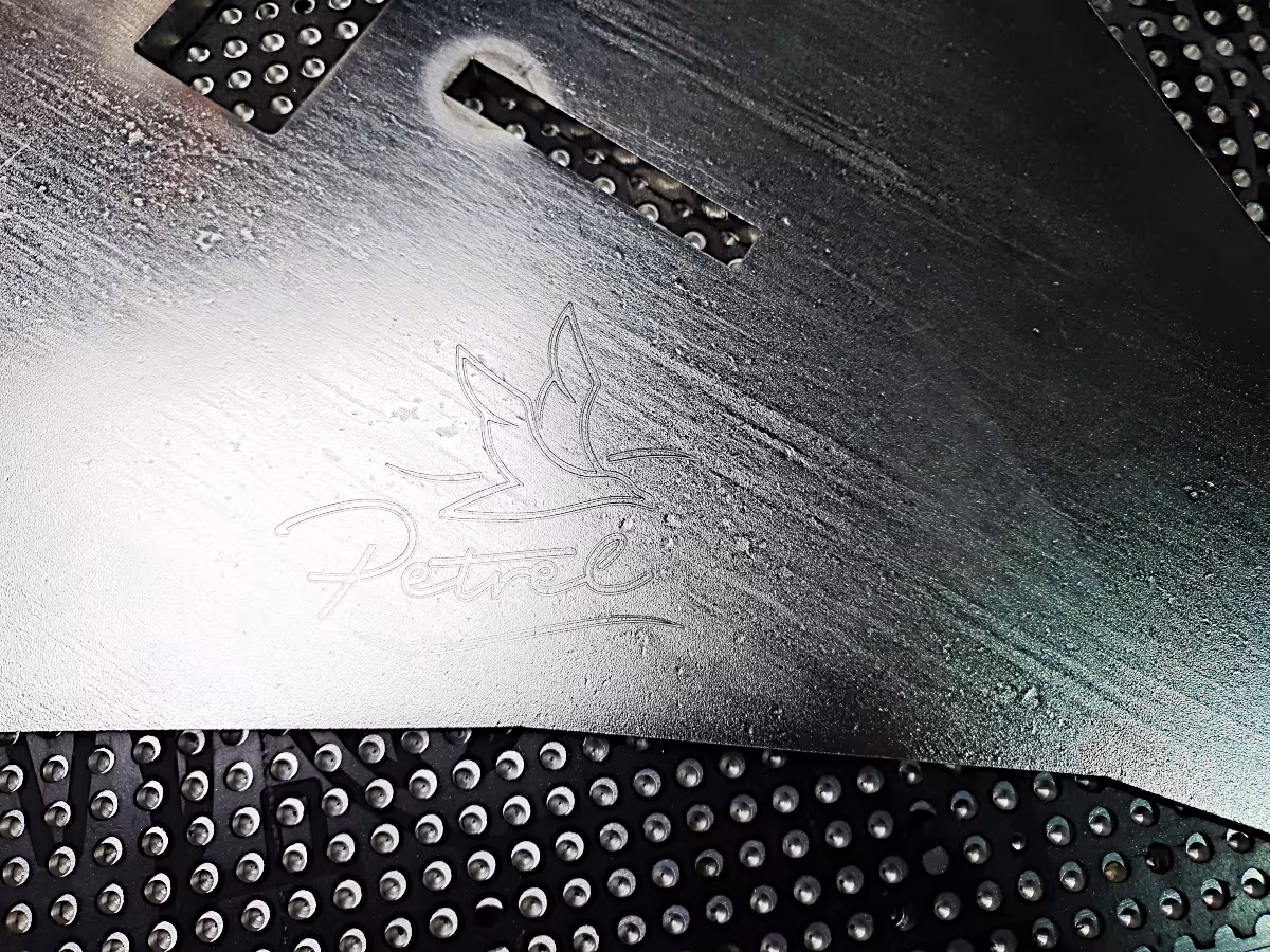 Image: Petrel logo engraved onto stainless steel anchor