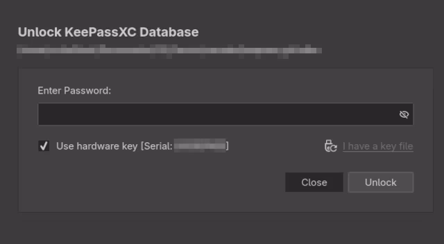 Image: KeePassXC's database unlock popup as presented on Linux and Windows machines. The option 'use hardware key' is ticked.
